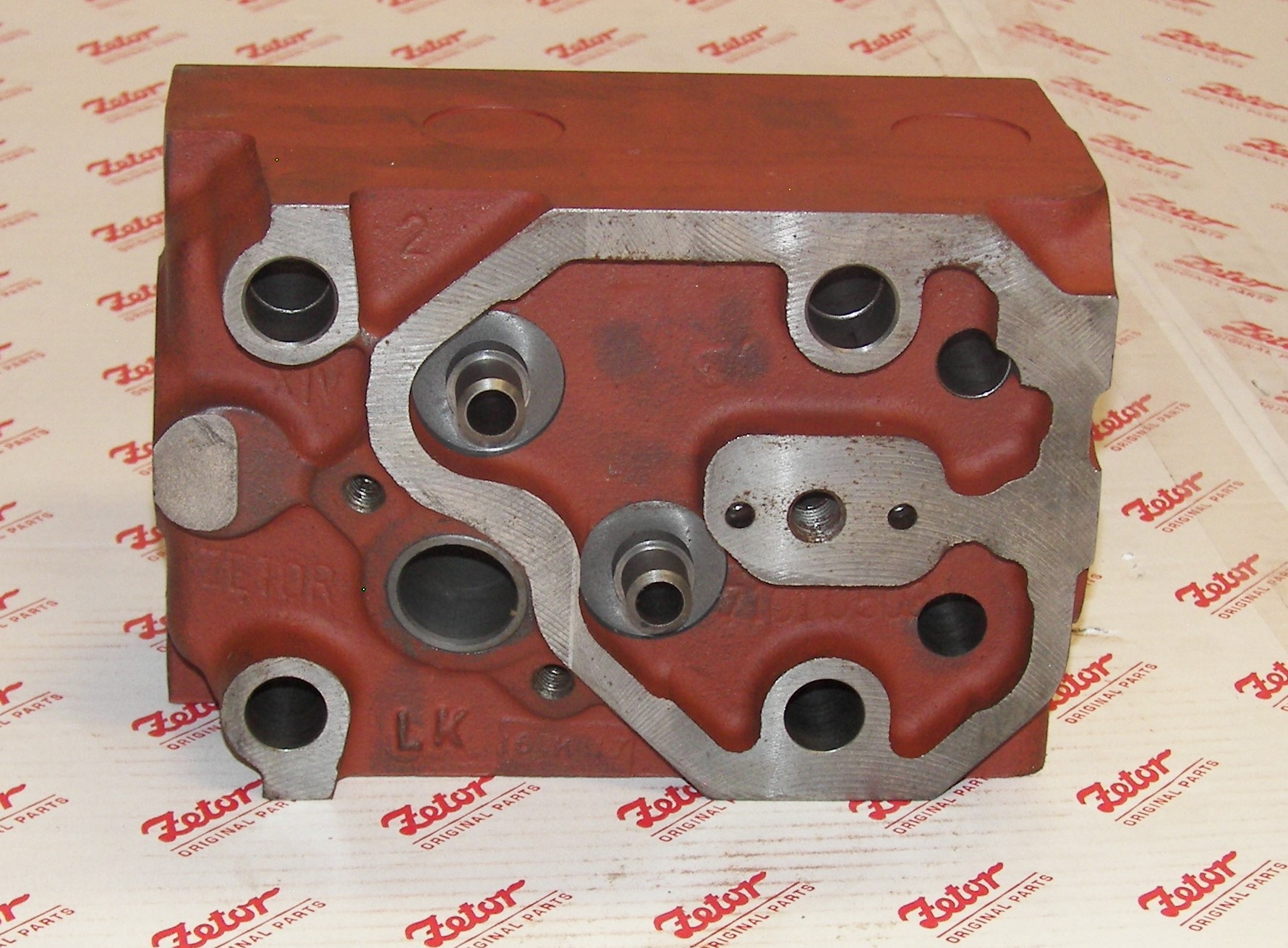 CYLINDER HEAD;  INCLUDES PLUGS AND VALVE GUIDES